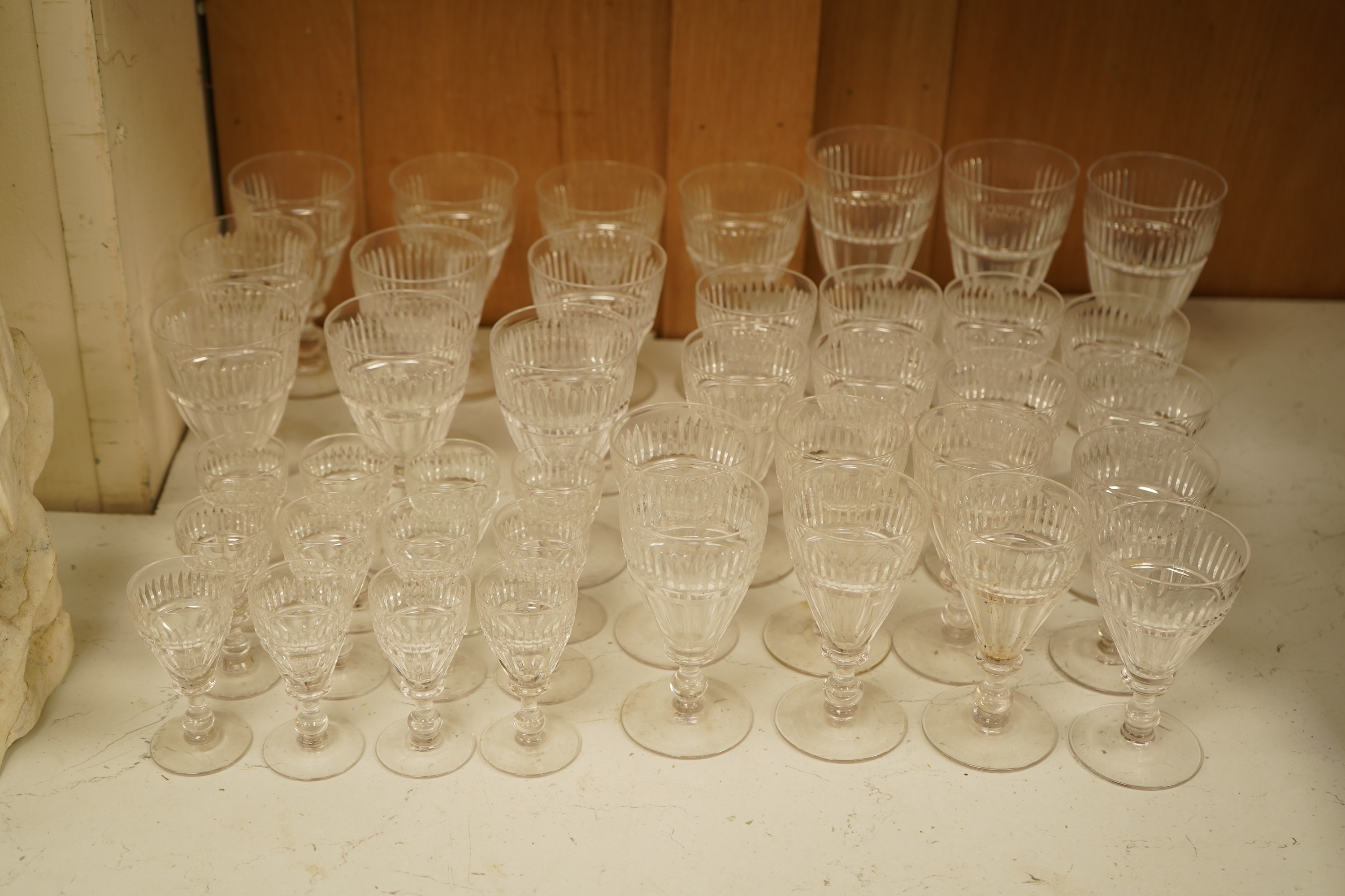 A part suite of 19th century cut glass drinking glasses, largest 13cm high
